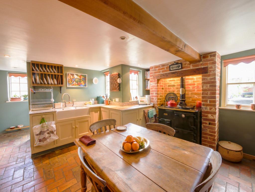 A charming deceptively spacious Cottage dating back to 1750, benefitting from FIVE bedrooms, a pretty walled garden and many interesting features.