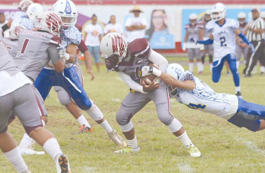 COMPETITION 3-0-0 C Y M K Tafuna s kick off returner was immediately apprehended in the backfield by a Samoana Shark, during the opening quarter of a Junior Varsity match up last Saturday morning.