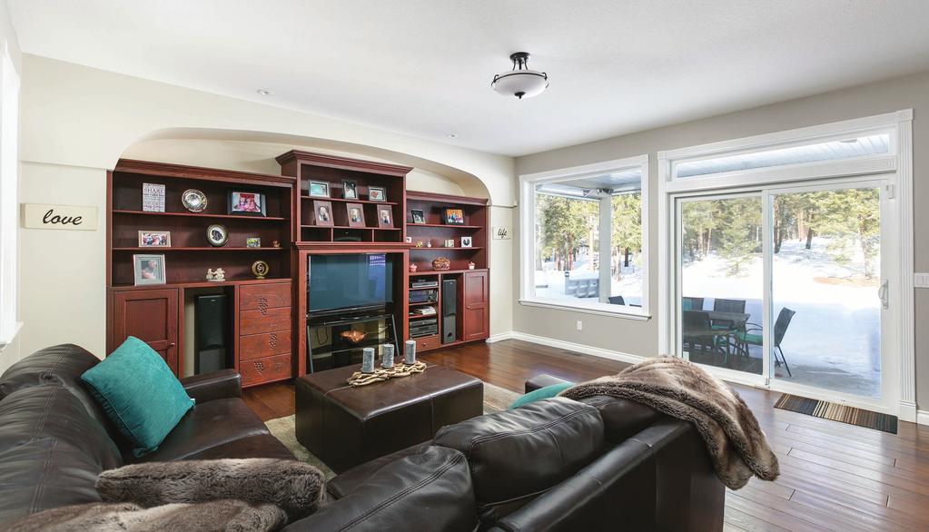 floor Large family room with custom cabinetry