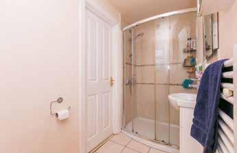 Fully tiled shower cubicle with