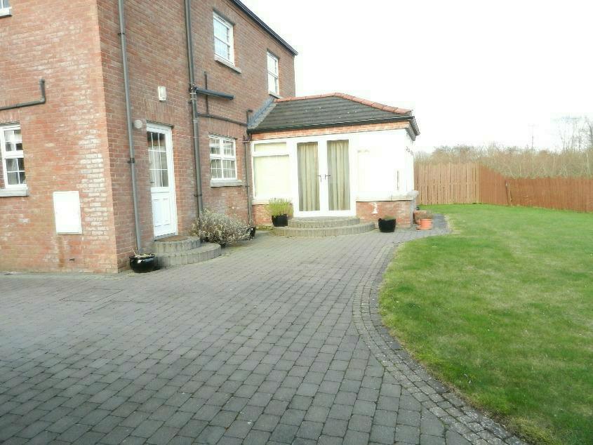 Pavior driveway with extensive parking area. Pavior patio and paths.