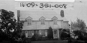 1380 East Harvard Avenue Built 1932 Asbestos Siding / Stone Veneer Colonial