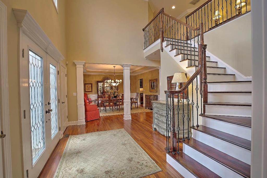Foyer / Hall: Natural cherry hardwood floors, beautiful leaded glass double front door and