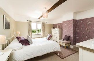 This bedroom also benefits from an en-suite shower room.
