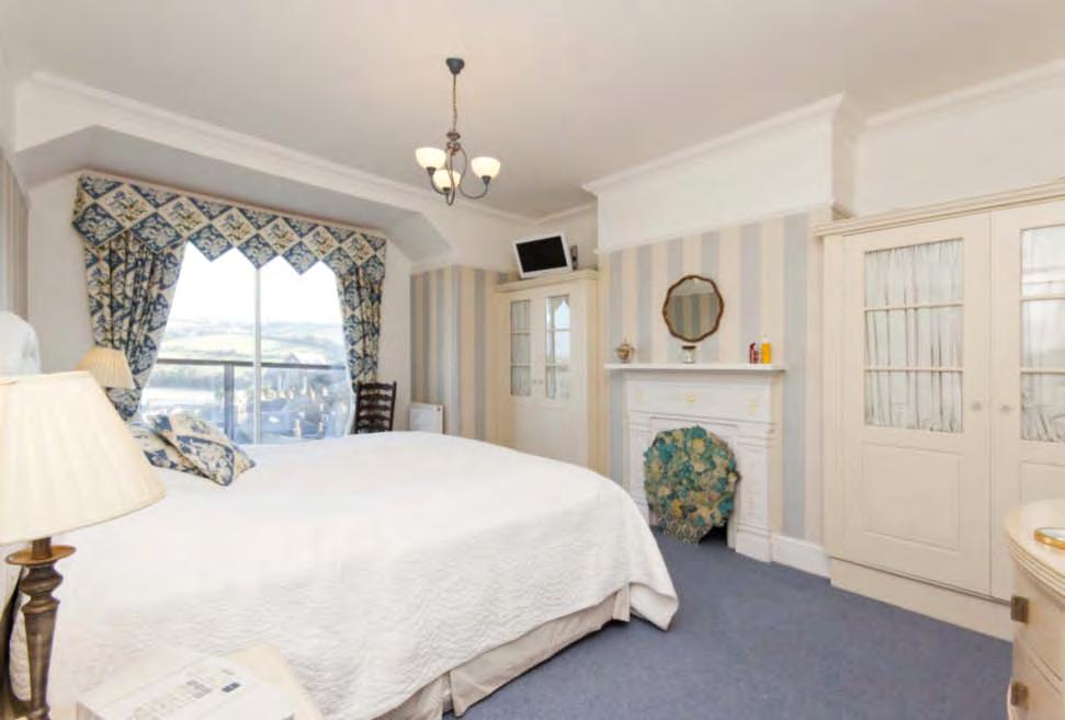 facing dormer with full height double glazed sliding window opening onto balcony. Breathtaking views of the active harbour scene, the estuary and the East Portlemouth beaches.