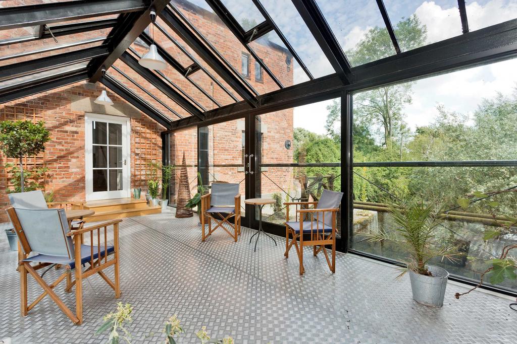 An outstanding contemporary conversion of this striking Grade II* Listed former pump house, in a peaceful rural setting with gardens and land Accommodation in Brief Two buildings with glazed link