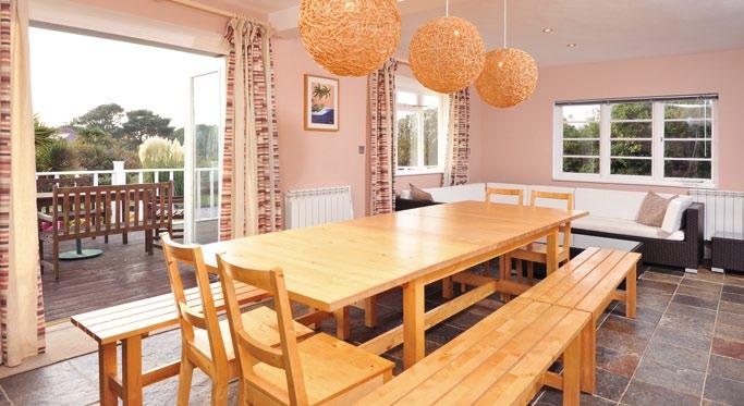The Blue House For sale freehold The Blue House is a fabulous and spacious family home designed in a Cape Cod style situated on the edge of the popular village of Tregurrian.