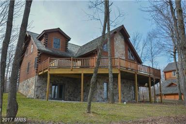 Open Floor w/ Post & Beam style construction on 3- levels, two fireplaces & outdoor deck and patio w/ Hot Tub.
