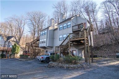 VIEWS OF DEEP CREEK LAKE & MOUNTAINS FROM LIVING ROOM. LOWER LEVEL TOTALLY FINISHED & OFFERS BONUS ROOM FOR MANY ADDITIONAL OPTIONS TO THE OWNER.