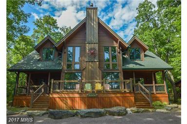 Designed to be a Tranquil getaway, relax on the back deck and listen to the babbling stream. Open floor plan, wide planked hardwood floors, kitchen island and breakfast bar.