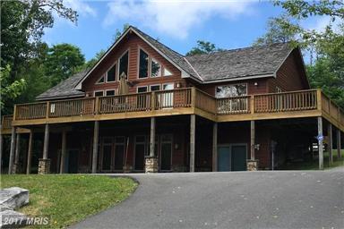 5000+ sq ft living space. Perfect location on top of Wisp Mountain with 3 private acres minutes from skiing, whitewater rafting and all area activities.