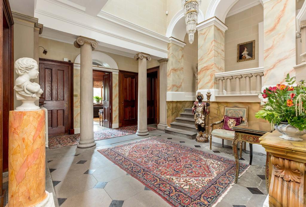 The drawing room ceiling is based on the design for the gates of the Parthenon and the original fireplace echoes the design of the entrance porch.