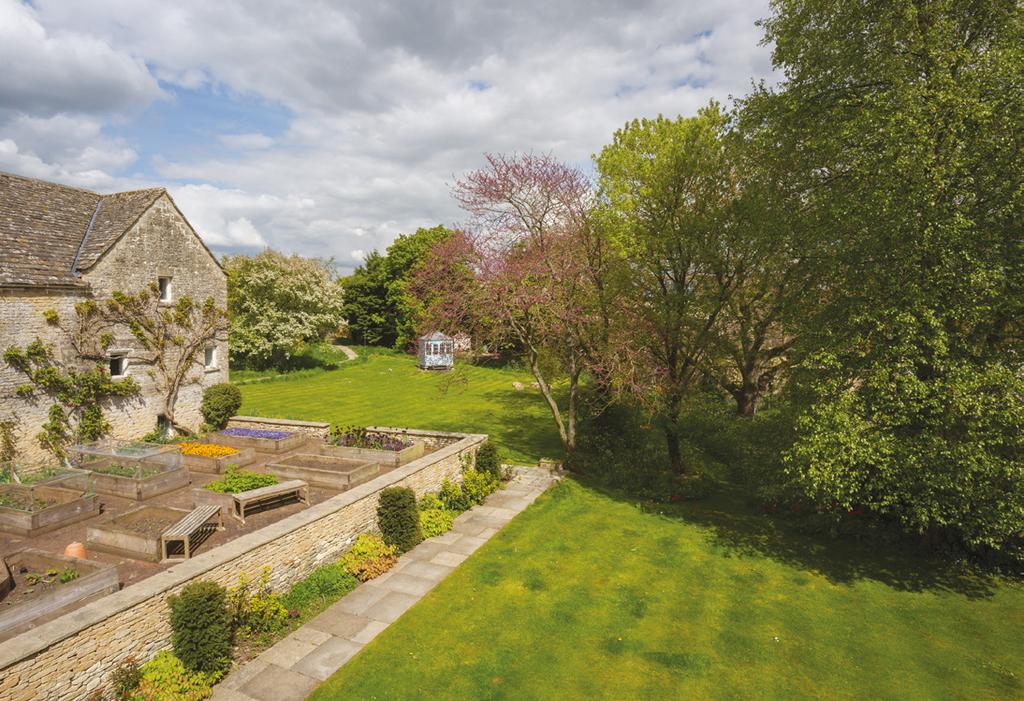 OUTSIDE Whist within the village, Taylers Farmhouse is accessed by a quiet no through road, providing a secure and tranquil position standing within mature landscaped gardens and terraces.
