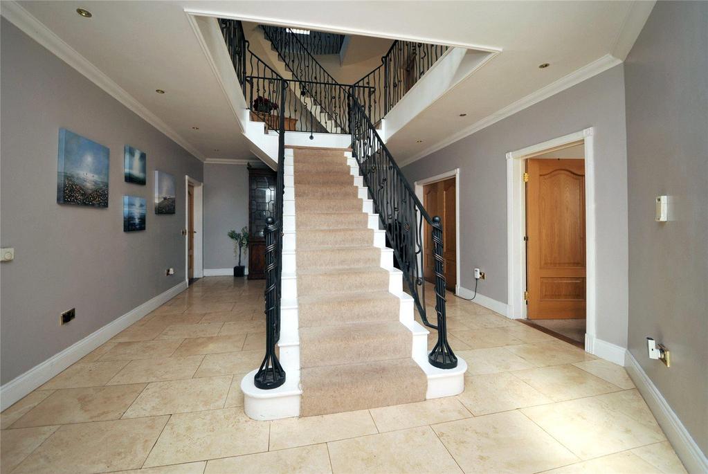 An exclusive gated development of four imposing detached property positioned in a woodland setting.