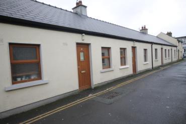 Kildare: Mid terrace 2 storey converted residence 1 x 1 bedroom apartments and 3 x 2 bedroom apartments.