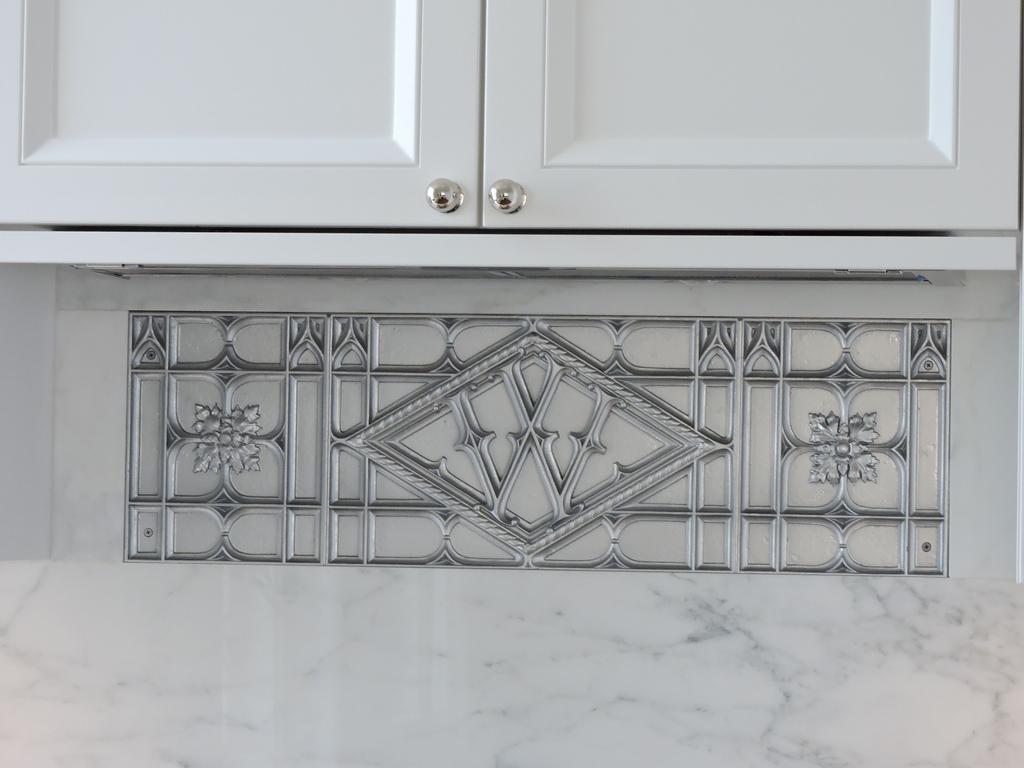 While most of the Woolworth Building is still office space, its upper floors now have condos. This detail in the kitchens is inspired by its original elevators.