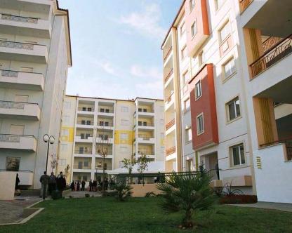 much activity) Workers Housing Organisation (OEK) provides social housing in settlements