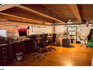 private post-production offices and conference room spaces. Mezzanine Level is currently set up as an open expansive group work area with hardwood floors.