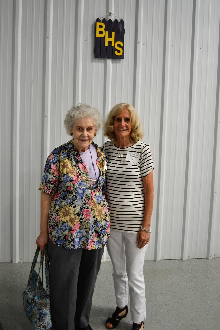 Recognition of those from the earliest class represented at the banquet went to Joan Bratton Holsapple (on left) from the class of 1942 (75 years