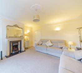Moving further into the property, there is a second reception room, currently used as a sitting room, this room also offering an open fireplace.