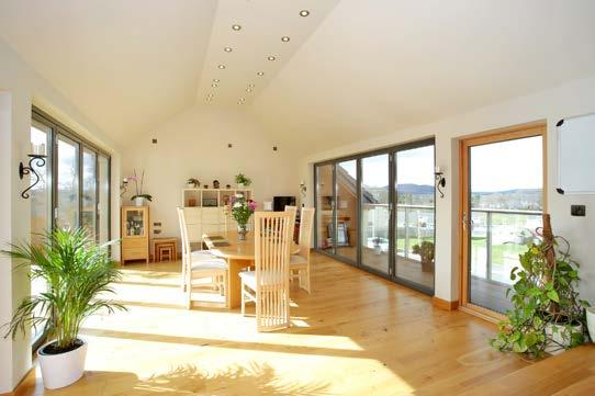 With bi-fold German doors to either side, with balcony to the front and decking to the rear, this area could, in sunny weather become a