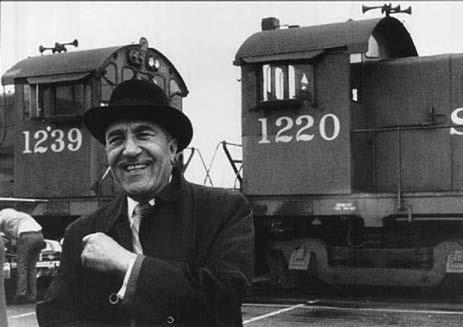 C.L. Dellums smiling standing in front of locomotive (Oakland Public Library, African American Museum and Library at Oakland) Dellums went on to serve as the vice president of the BSCP, establishing