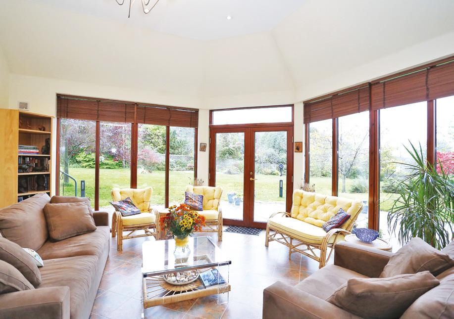 The lounge is a particularly attractive room with a fireplace with living flame gas fire and a large window overlooking the garden to the south.