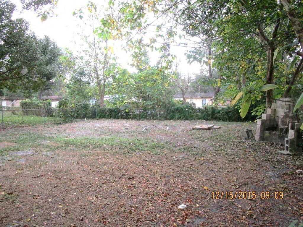The backyard of this Bank of America foreclosure is neglected and uncared for.