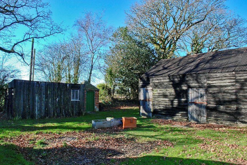 At the rear of the property there is a small area of lawn and access to outbuildings. The outbuildings consist of a barn split into three stables, one implement store/tack room and a feed store.
