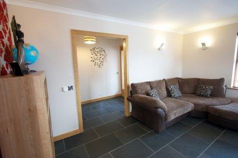 Accommodation Entrance Porch : Outer door, slate tile flooring, door to hall.