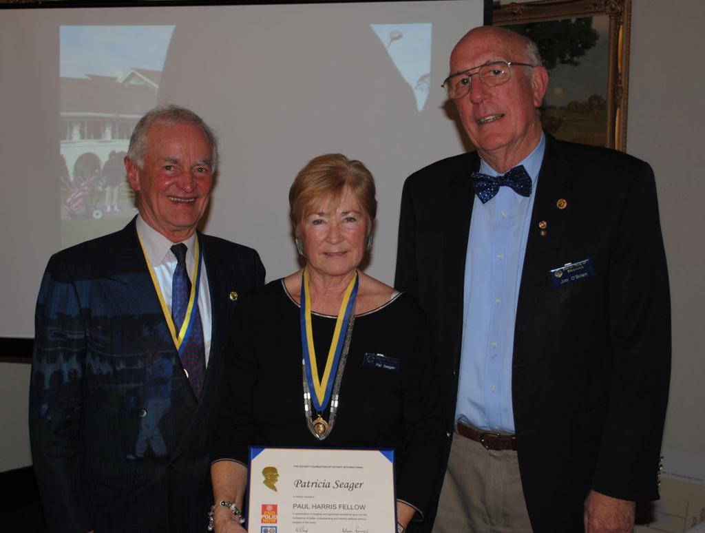 Juliet Pat with her PHF surrounded by Sapphire recipients Roy and Jim