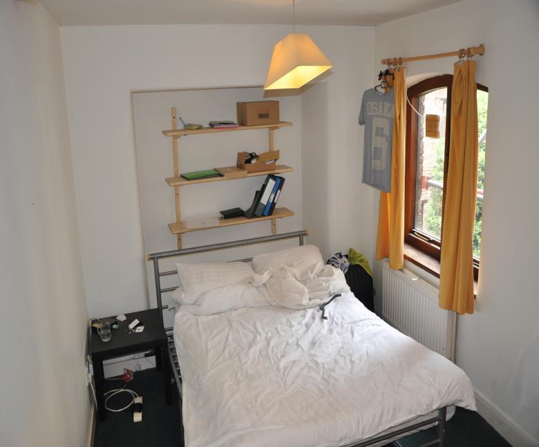 Wall mounted radiator. Tiled splash backs. Bedroom 1 Door into bedroom 1 from the landing. Double bed with mattress.