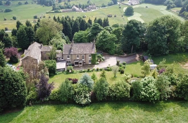 It is set on a hill and approached by a long tree-lined driveway. The house is separated from Grimescar Road by its own large paddock which provides a secluded and peaceful setting.