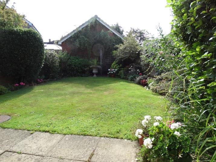 OUTSIDE The property enjoys an area of front garden,