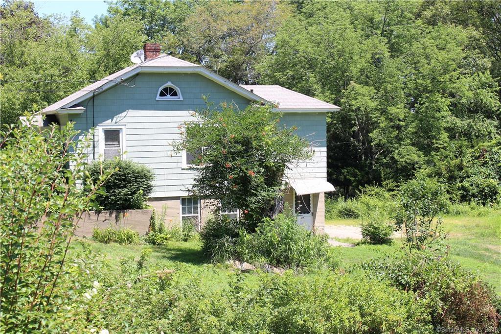 This house has great income potential and offers hardwood floors and updated windows. Situated on 2.41 acres this property also includes a 2 1/2 car barn/garage.