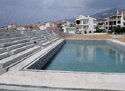 SWIMMING-POOL OF 600 SPECTATORS CAPACITY WITH