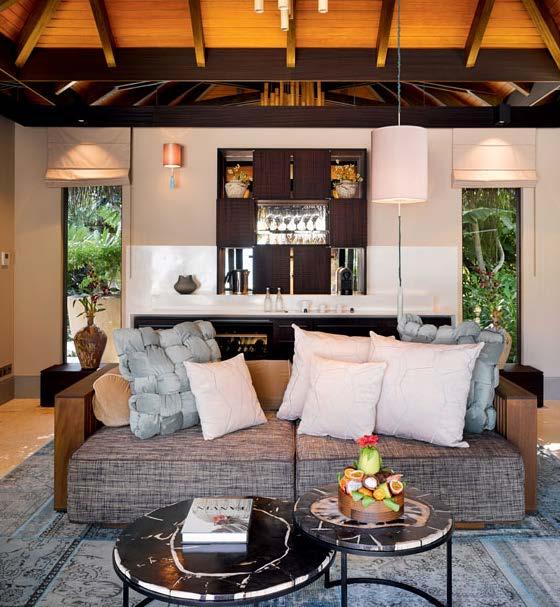 These private one-bedroom beachfront pool villas feature a separate large living room,