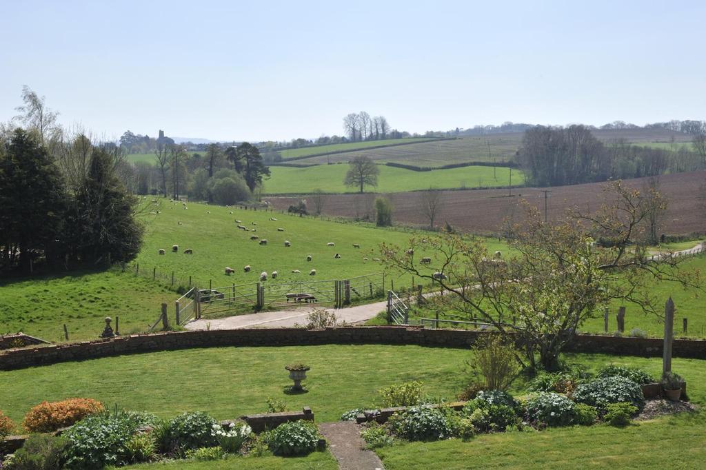 five bedroom farmhouse, enjoying an elevated position Two detached with holiday the benefit letting barns of (3 far bed and 2 bed). reaching southerly views.