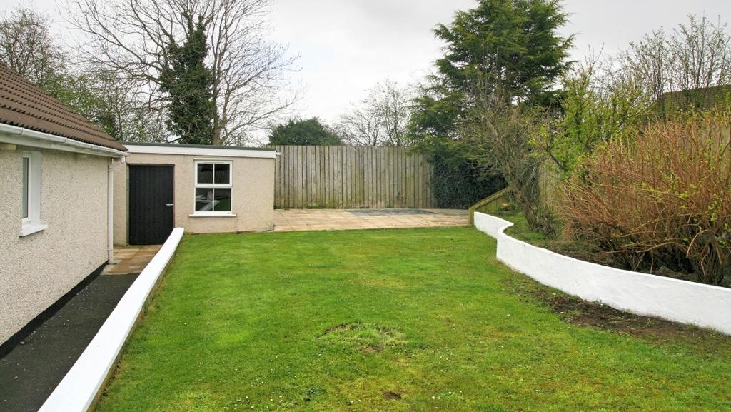 Back Garden A well designed and superbly presented garden with planted walled boundary to