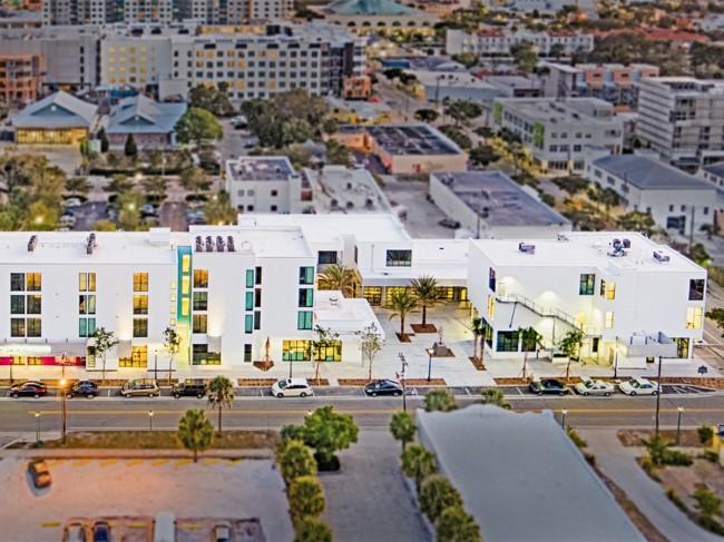 The project includes three buildings housing 30 residential units for performers of the Sarasota Opera, dance and theatre studio spaces, and 30,000 sf of ground floor retail and office space.