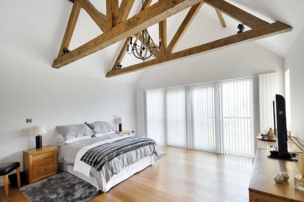 Private and peaceful at the top of the house, the guest bedroom has a chic en suite shower room