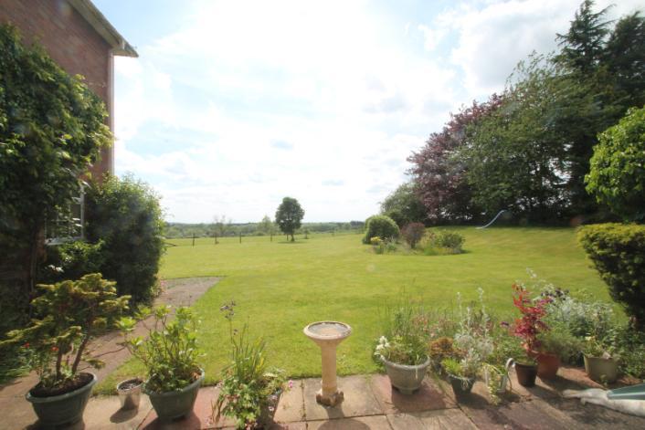 Lot 1 Comprising a house, large garden with 1.47 acres of paddock land.