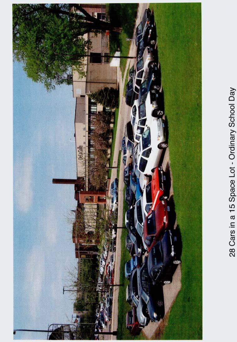Exhibit E: photo 28 Cars in a 15 Space Lot Ordinary School Day