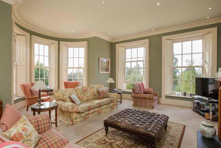 Semi circular bay window overlooking gardens, panelled windows to front with fitted shutters overlooking trees towards Belfast Lough and the County Antrim hills.