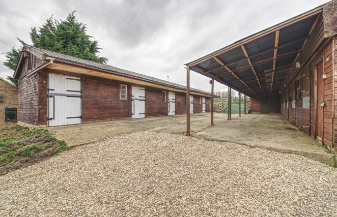 Behind the garages, there are two stable blocks running in parallel to each other with a total of 10 stables, a store room/feed room and a tack room.