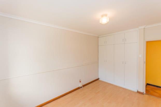 floors and ample floor to ceiling built-in cupboards.