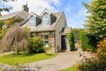 Accommodation house A welcoming entrance porch leads into the open plan sitting dining room with an attractive stone fireplace and wood burning stove providing a warm focal point.