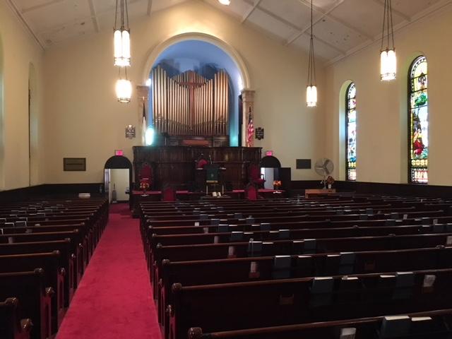 There is an elevated choir seating area behind the pulpit.