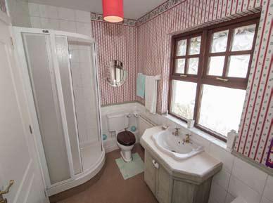54m) Two built in wardrobes with excellent hanging and shelving space. BATHROOM: Fully tiled corner shower cubicle with thermostatic shower. Low flush WC.