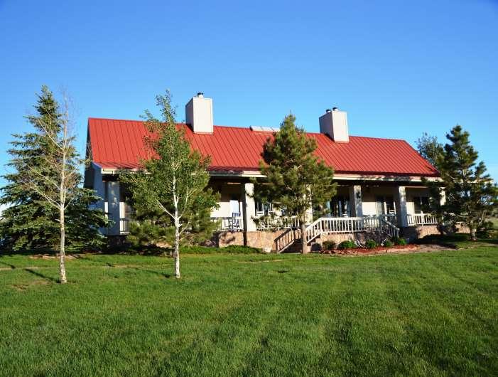 IMPROVEMENTS Two wonderful homes sit roughly a hundred yards off the banks of the Laramie River; overlooking the river and